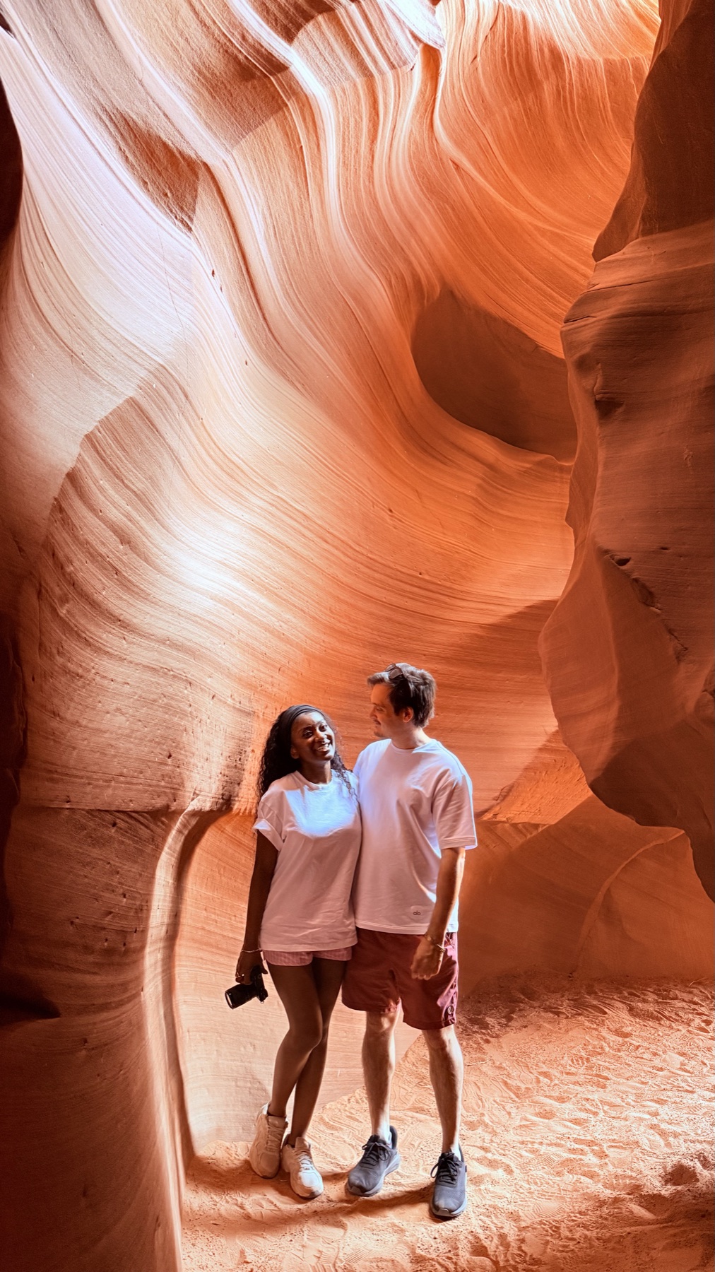 Marie and Matthew together in a glowing red-rock canyon
